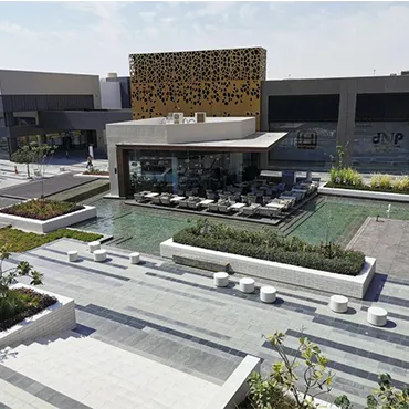 Completed mall exterior landscape with terraces, water, and paved public space